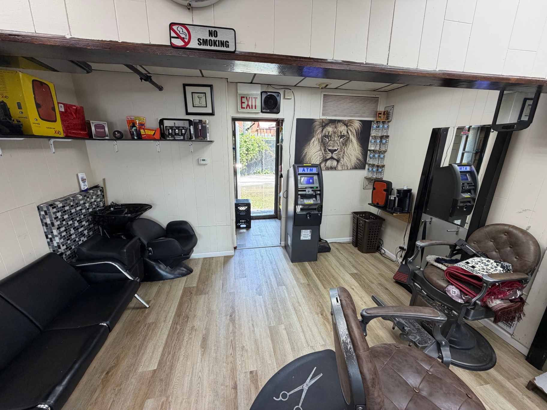 Wash station and wall decor inside the Oak Lawn barber shop